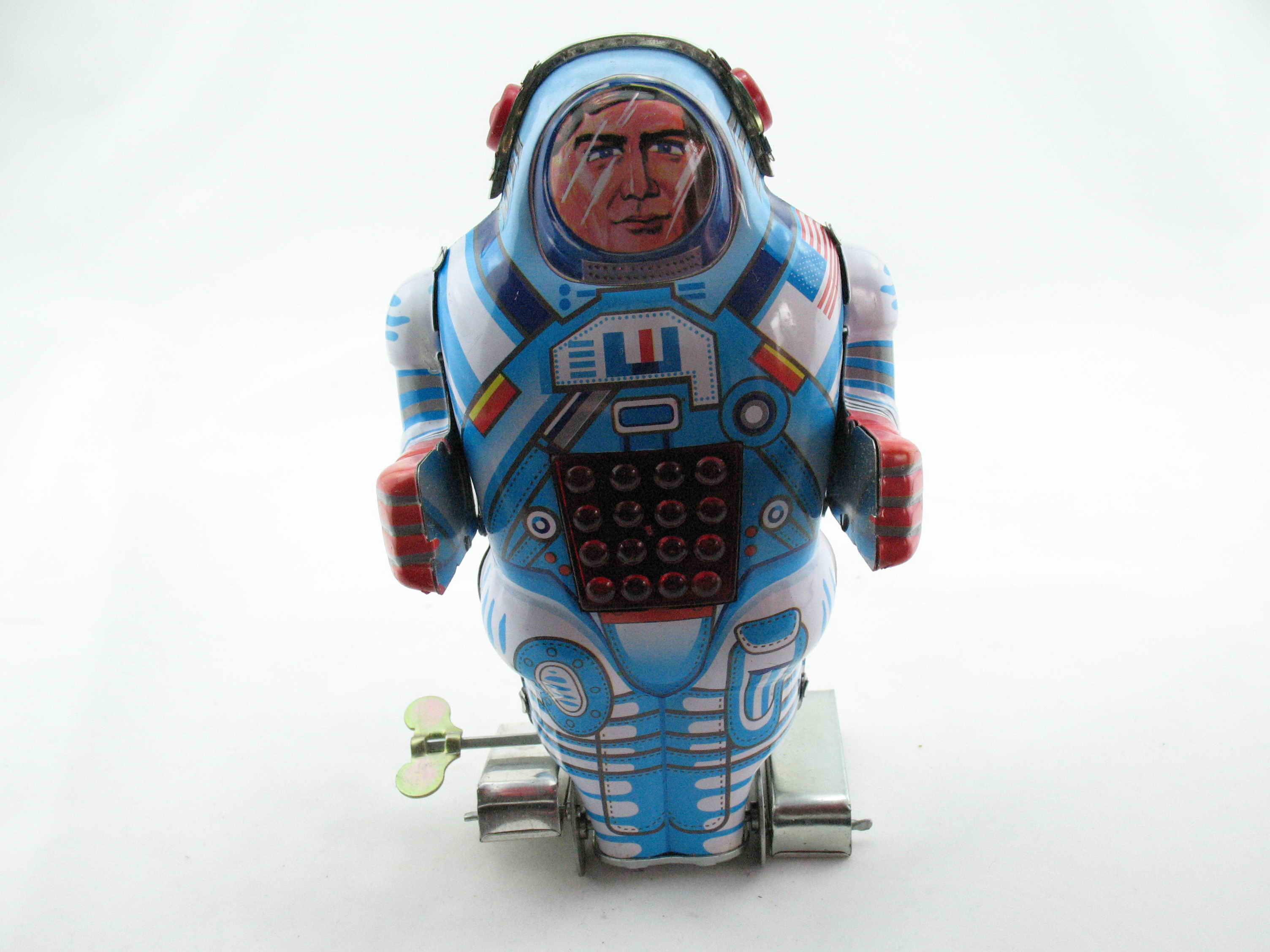 Blechspielzeug - Roboter-Astronaut mit Feuerstein auf Raupenfüßen